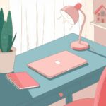 A pastel-toned desk setup with a laptop, notebook, lamp, and plant. A small decorative house is visible on a shelf.