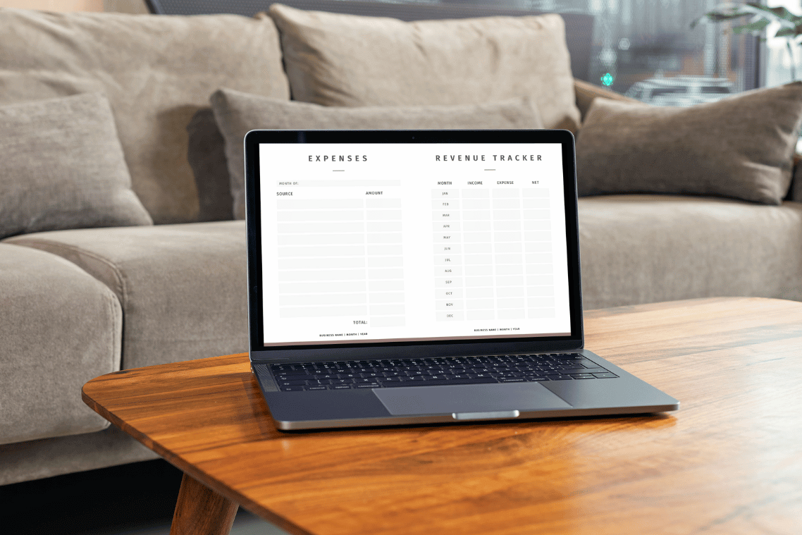 laptop on a coffee table with sofa background